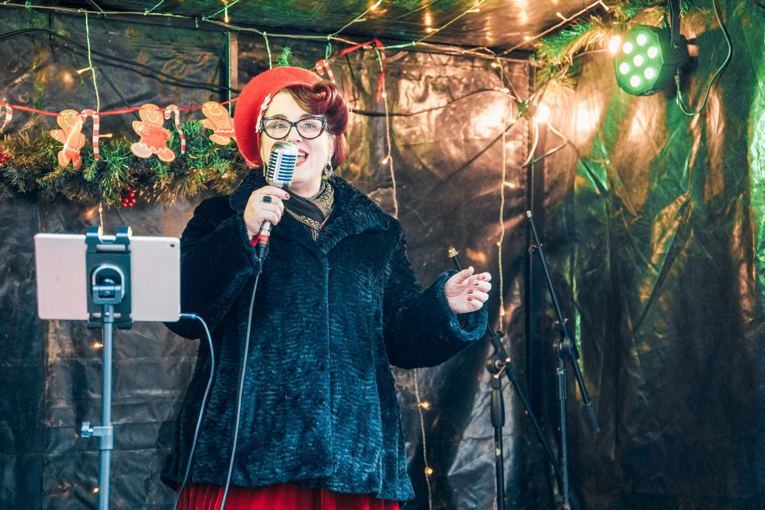 A woman singing on the Victorian Fayre stage